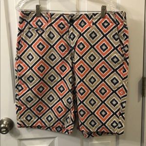 orange, navy, lt blue, and beige print short